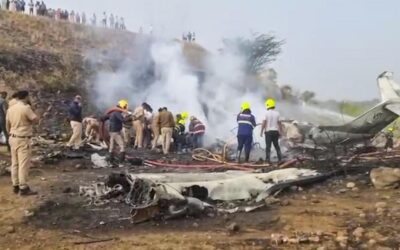 Rescue and police personnel search for survivors after an aircraft carrying Maharashtra Deputy Chief Mini